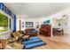 Spacious living room with hardwood floors and stylish decor, creating an inviting atmosphere at 1410 S Ammons St, Lakewood, CO 80232