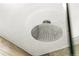 Close-up of a modern rain-style shower head in a beautifully renovated bathroom at 1410 S Ammons St, Lakewood, CO 80232