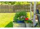 Charming backyard flower garden pot with blooming flowers, adding natural beauty to the well-maintained outdoor space at 1410 S Ammons St, Lakewood, CO 80232