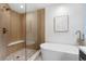 Modern bathroom featuring walk-in shower, soaking tub, and unique fixtures at 3047 S Cherokee St, Englewood, CO 80110