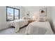 Cozy bedroom featuring two beds, soft decor, and bright natural light at 3047 S Cherokee St, Englewood, CO 80110