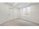 Neutral bedroom features carpet, neutral paint, a window, and a sliding closet door at 3047 S Cherokee St, Englewood, CO 80110