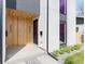 Home's modern doorway with wooden accent, stylish black door, and minimalist landscaping at 3047 S Cherokee St, Englewood, CO 80110