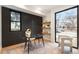 Bright home office with accent wall, modern desk, chair, and large windows providing ample natural light at 3047 S Cherokee St, Englewood, CO 80110