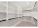 Walk-in closet with ample shelving and storage space, offering organized and functional design at 3047 S Cherokee St, Englewood, CO 80110
