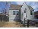 Charming cottage home featuring a well-maintained front yard, neutral paint and a peaked roof line at 118 S Dale Ct, Denver, CO 80219