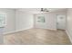 Bright living room with modern flooring, fresh paint and natural light at 118 S Dale Ct, Denver, CO 80219