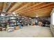 Spacious unfinished basement with exposed rafters, shelving, and lighting at 10572 Jaguar Gln, Lone Tree, CO 80124