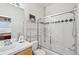 Bright bathroom with a glass-enclosed shower, chrome fixtures, a vanity, and white tiles; creates a clean and functional space at 10572 Jaguar Gln, Lone Tree, CO 80124
