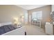 Comfortable bedroom with window and storage; creates a personal and cozy space within the home at 10572 Jaguar Gln, Lone Tree, CO 80124