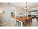 Bright dining room with a long table and seating for eight, perfect for gatherings at 10572 Jaguar Gln, Lone Tree, CO 80124