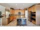 Modern kitchen with granite countertops, stainless steel appliances, and ample storage space with an island for food prep at 10572 Jaguar Gln, Lone Tree, CO 80124
