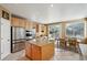 Kitchen with stainless steel appliances, granite counters, an island, and breakfast nook at 10572 Jaguar Gln, Lone Tree, CO 80124
