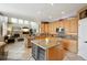 Spacious kitchen with an island, stainless steel appliances, and hardwood floors, ideal for cooking and entertaining guests at 10572 Jaguar Gln, Lone Tree, CO 80124