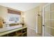 Bright home office with built-in desk, ample storage, and natural light at 10572 Jaguar Gln, Lone Tree, CO 80124