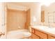 Full bathroom with tiled shower/tub combination and mirrored vanity at 654 S Xenon Ct, Lakewood, CO 80228