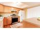 Kitchen featuring light wood cabinets, stainless steel appliances, and a bright atmosphere at 654 S Xenon Ct, Lakewood, CO 80228