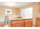 Bright kitchen island and dining area with access to the outdoor space at 654 S Xenon Ct, Lakewood, CO 80228