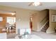 View of a neutral living space, looking into dining area and stairway at 654 S Xenon Ct, Lakewood, CO 80228