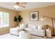 Inviting living room with neutral tones, large window, and modern furnishings at 654 S Xenon Ct, Lakewood, CO 80228