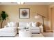 Bright living room featuring a comfortable, white sectional sofa and stylish decor at 654 S Xenon Ct, Lakewood, CO 80228