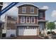 Charming under-construction home with a two-car garage, brick driveway, and neutral color palette at 1193 Highview Ln, Erie, CO 80516