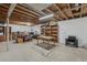 Unfinished basement with exposed ceiling beams, open space, and potential for customization at 1164 W 101St Pl, Northglenn, CO 80260