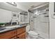 Bathroom with a granite countertop, a shower with glass door, and a spacious design at 1164 W 101St Pl, Northglenn, CO 80260