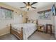 Bedroom with natural light, a ceiling fan, two windows, and neutral paint colors at 1164 W 101St Pl, Northglenn, CO 80260