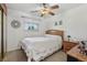 Cozy bedroom featuring neutral carpet, ceiling fan, natural wood furniture and a comfy bed at 1164 W 101St Pl, Northglenn, CO 80260