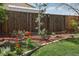 Landscaped garden bed showcasing vibrant red tulips and decorative stone edging at 1164 W 101St Pl, Northglenn, CO 80260