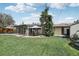 Charming patio area with outdoor seating, ideal for relaxing and enjoying the backyard at 1164 W 101St Pl, Northglenn, CO 80260