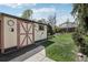 Attractive storage shed with a unique design, situated in a well-kept backyard at 1164 W 101St Pl, Northglenn, CO 80260