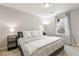 Relaxing bedroom features a large window, neutral gray walls, and cozy carpet at 2184 Willow Ct, Denver, CO 80238