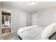 Neutral bedroom showing bathroom, two doors, and light grey colored carpet at 2184 Willow Ct, Denver, CO 80238