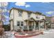 Attractive townhouses with covered porches and a brick garden bed in a well-maintained neighborhood at 2184 Willow Ct, Denver, CO 80238