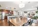 Open-concept layout connecting a modern kitchen to a bright and spacious living area at 2184 Willow Ct, Denver, CO 80238