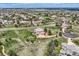 High angle view of a house in a scenic neighborhood featuring beautiful greenery and white fences, for luxurious living at 6411 Sand Rose Ct, Castle Rock, CO 80108