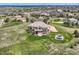 Captivating aerial view displaying an expansive yard with outdoor seating, set in a peaceful neighborhood with tree coverage at 6411 Sand Rose Ct, Castle Rock, CO 80108