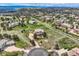 Beautiful aerial view showcasing a home's location within a neighborhood, surrounded by greenery and other well-maintained properties at 6411 Sand Rose Ct, Castle Rock, CO 80108