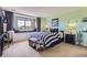 Whimsical bedroom featuring polka dot walls, striped bedding, and a cozy window seat at 6411 Sand Rose Ct, Castle Rock, CO 80108