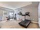 Home exercise room with treadmill, free weights, and natural light at 6411 Sand Rose Ct, Castle Rock, CO 80108