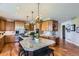 Spacious kitchen with granite countertops, stainless steel appliances, and hardwood floors at 6411 Sand Rose Ct, Castle Rock, CO 80108