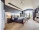 Spacious main bedroom featuring a large window, comfortable seating and neutral decor at 6411 Sand Rose Ct, Castle Rock, CO 80108