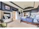Relaxing main bedroom with a fireplace, and built-in storage for a luxurious retreat at 6411 Sand Rose Ct, Castle Rock, CO 80108