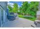 Landscaped backyard with a jacuzzi, patio, and trampoline offering plenty of outdoor space and activities at 6368 S Harlan Way, Littleton, CO 80123
