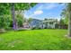 View of the backyard showcasing the deck and lush greenery at 6368 S Harlan Way, Littleton, CO 80123