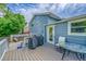 A cozy backyard deck with outdoor seating and a grill, perfect for outdoor entertaining and relaxation at 6368 S Harlan Way, Littleton, CO 80123