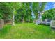 Large, lush backyard with a deck is perfect for entertaining and relaxation at 6368 S Harlan Way, Littleton, CO 80123