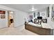 Basement living space with a sofa, TV, adjacent room and decor for a relaxing atmosphere at 6368 S Harlan Way, Littleton, CO 80123